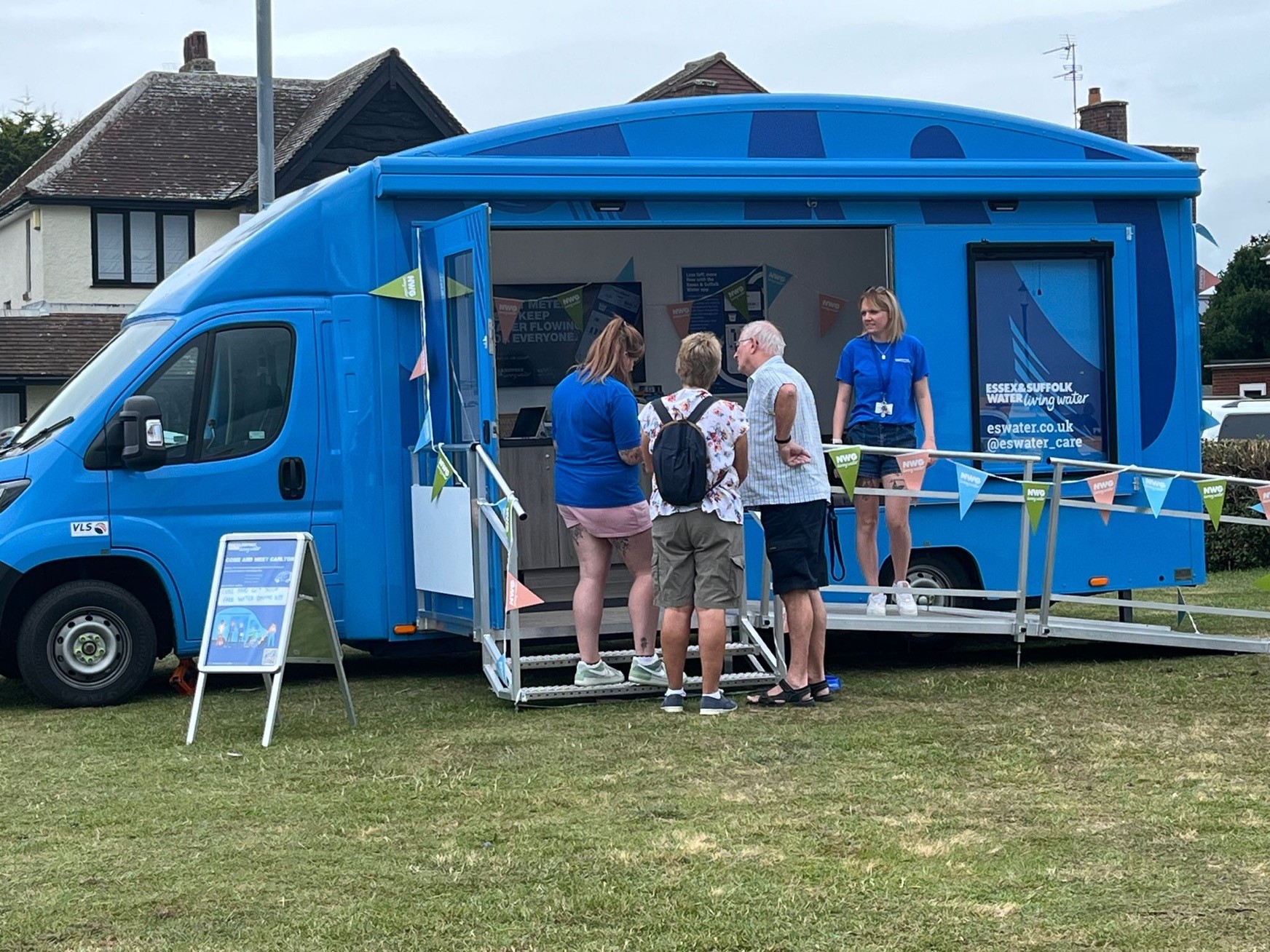 carlton van with people standing outside